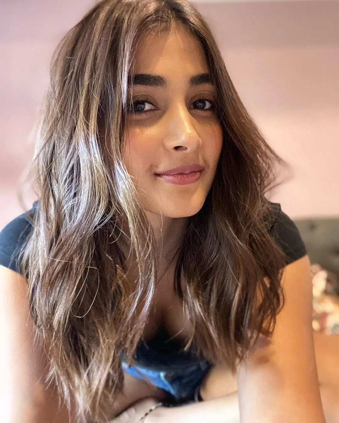 Pooja Hegde Smiling in Black Tee with Loose Wavy Brown Hair
