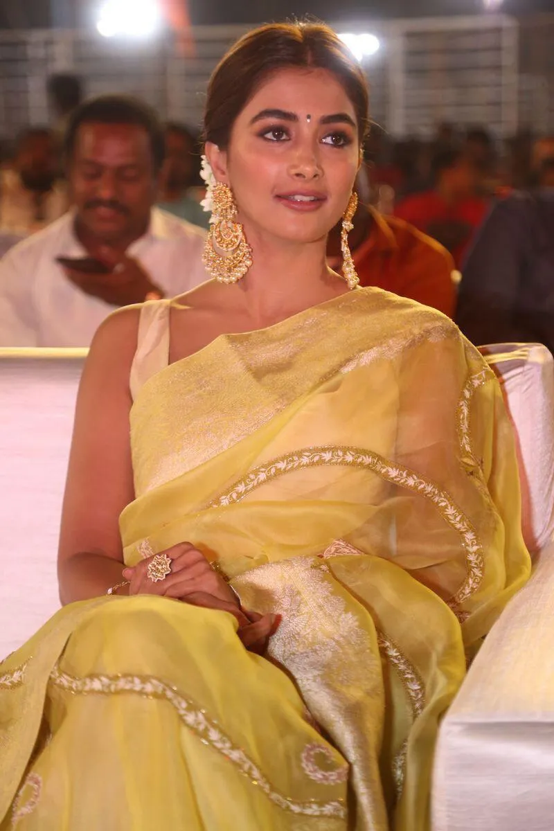 Pooja Hegde Smiling in Graceful Yellow Saree Outfit