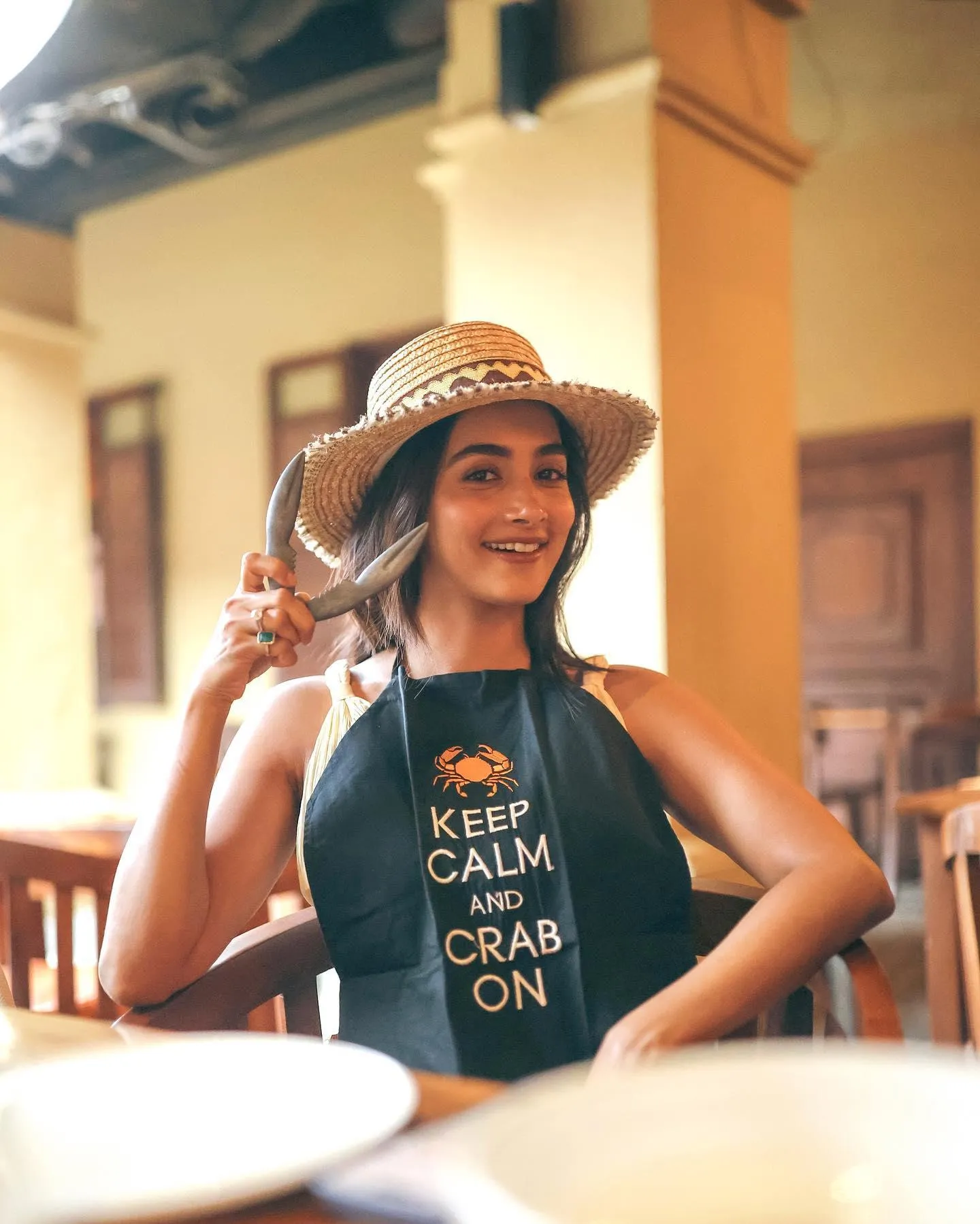 Pooja Hegde Smiling in Summer Outfit with a Straw Hat