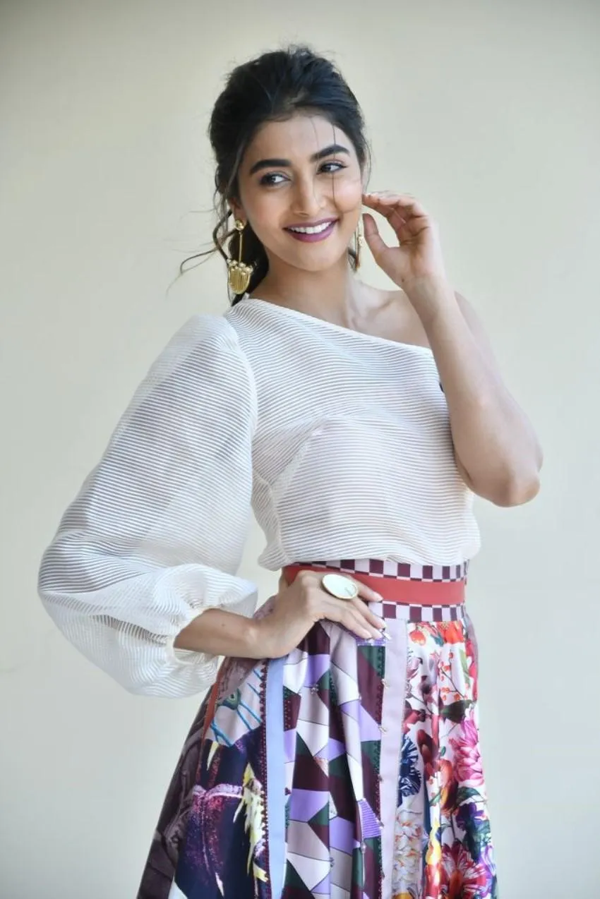 Pooja Hegde Smiling in White Top and Printed Skirt