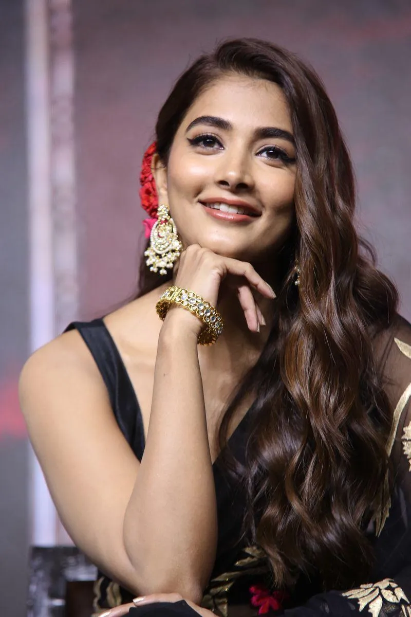 Pooja Hegde Smiling Wearing Black Dress and Long Hair