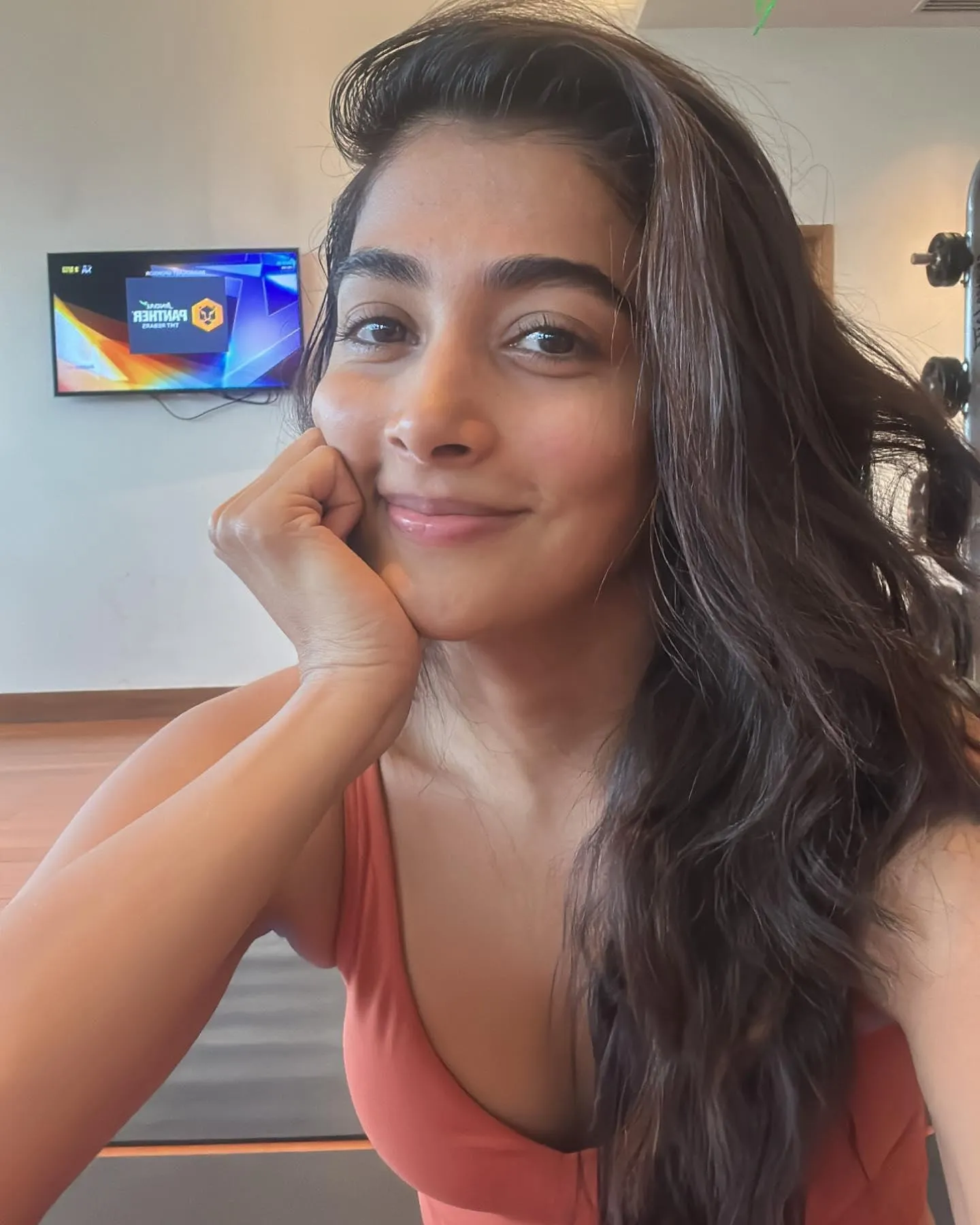 Pooja Hegde Smiling with Hand on Cheek in Casual Look