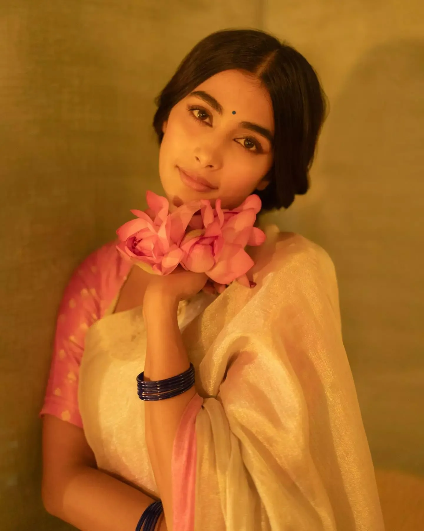 Pooja Hegde Soft Pose Wearing White Saree with Flowers