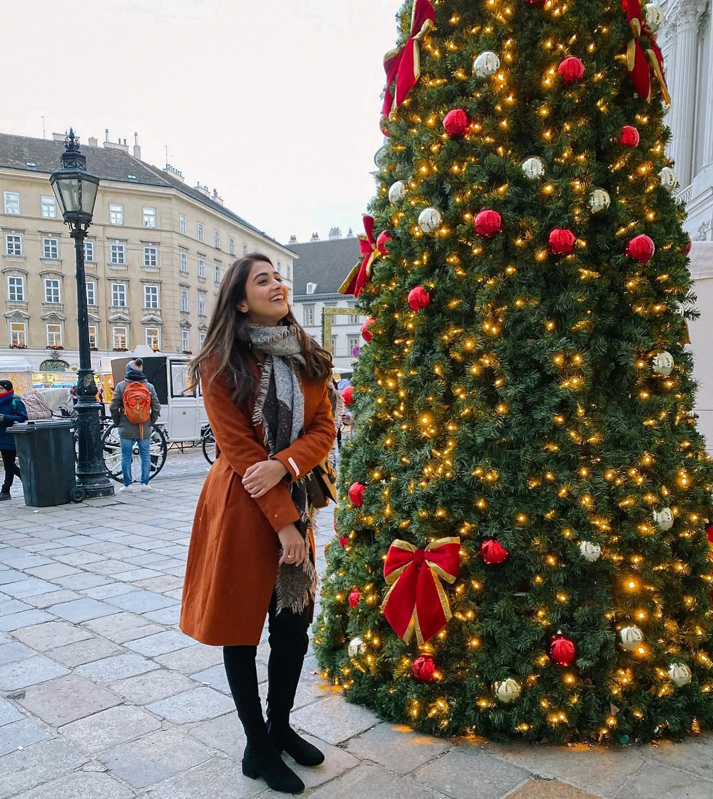 Pooja Hegde Standing Beside Large Christmas Tree in Town