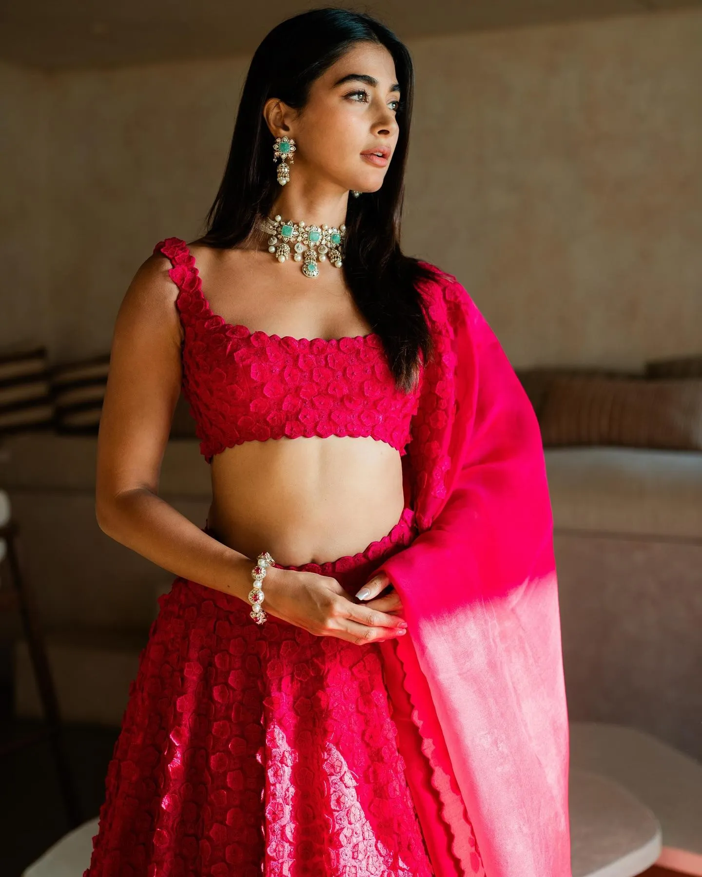 Pooja Hegde Standing Gracefully in Bright Pink Dress