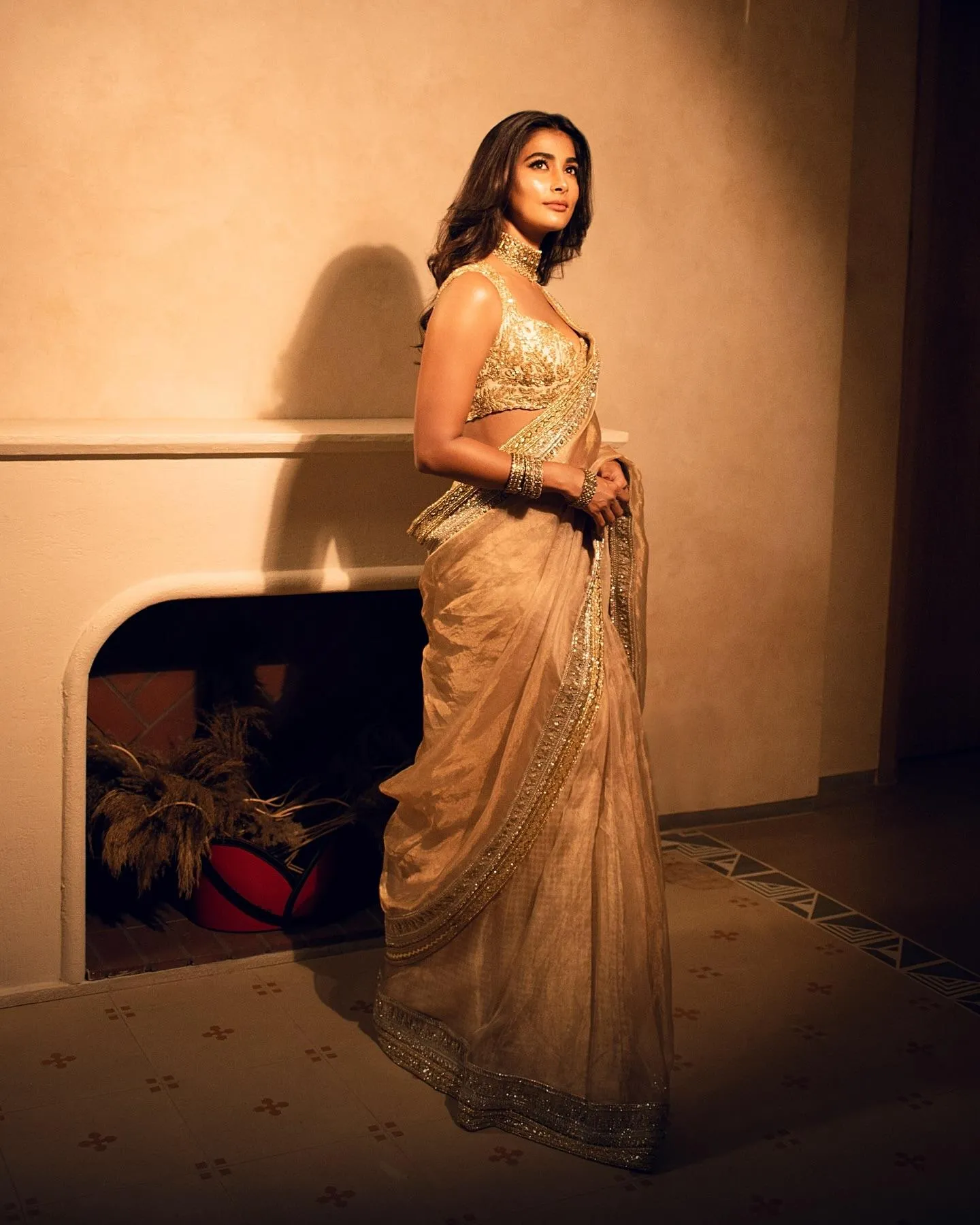 Pooja Hegde Standing Indoors in Beautiful Gold Embroidered Dress