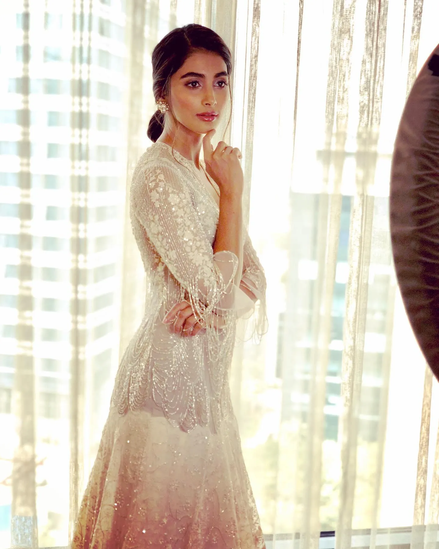 Pooja Hegde Standing Near Window Wearing White Dress
