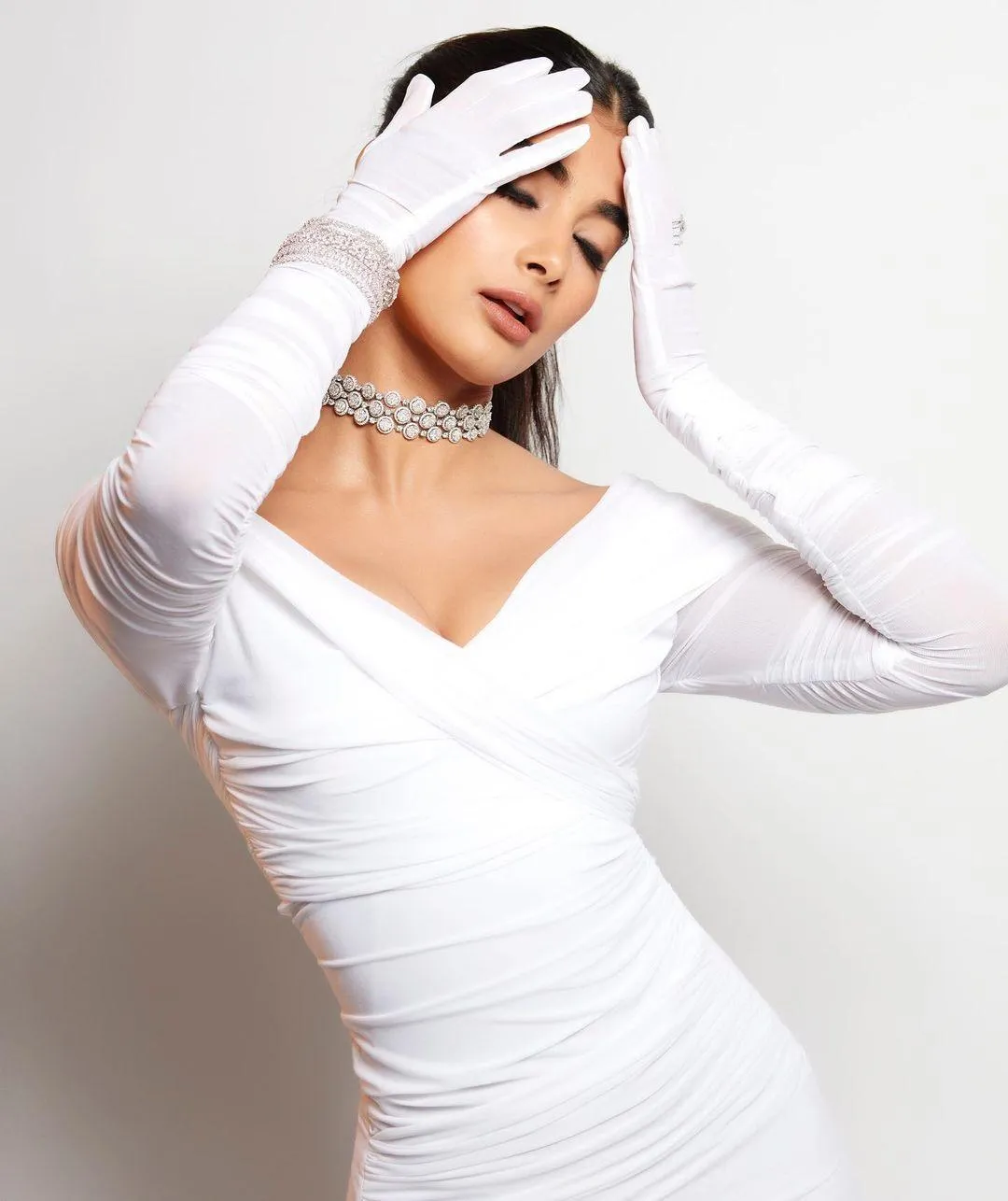 Pooja Hegde Strikes a Pose in White Ruched Bodycon Dress