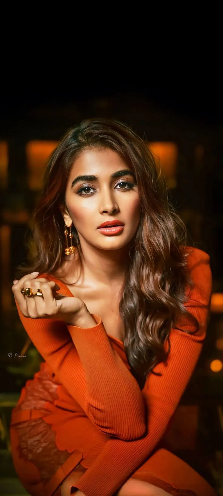 Pooja Hegde Strikes a Serious Pose Wearing Orange Outfit