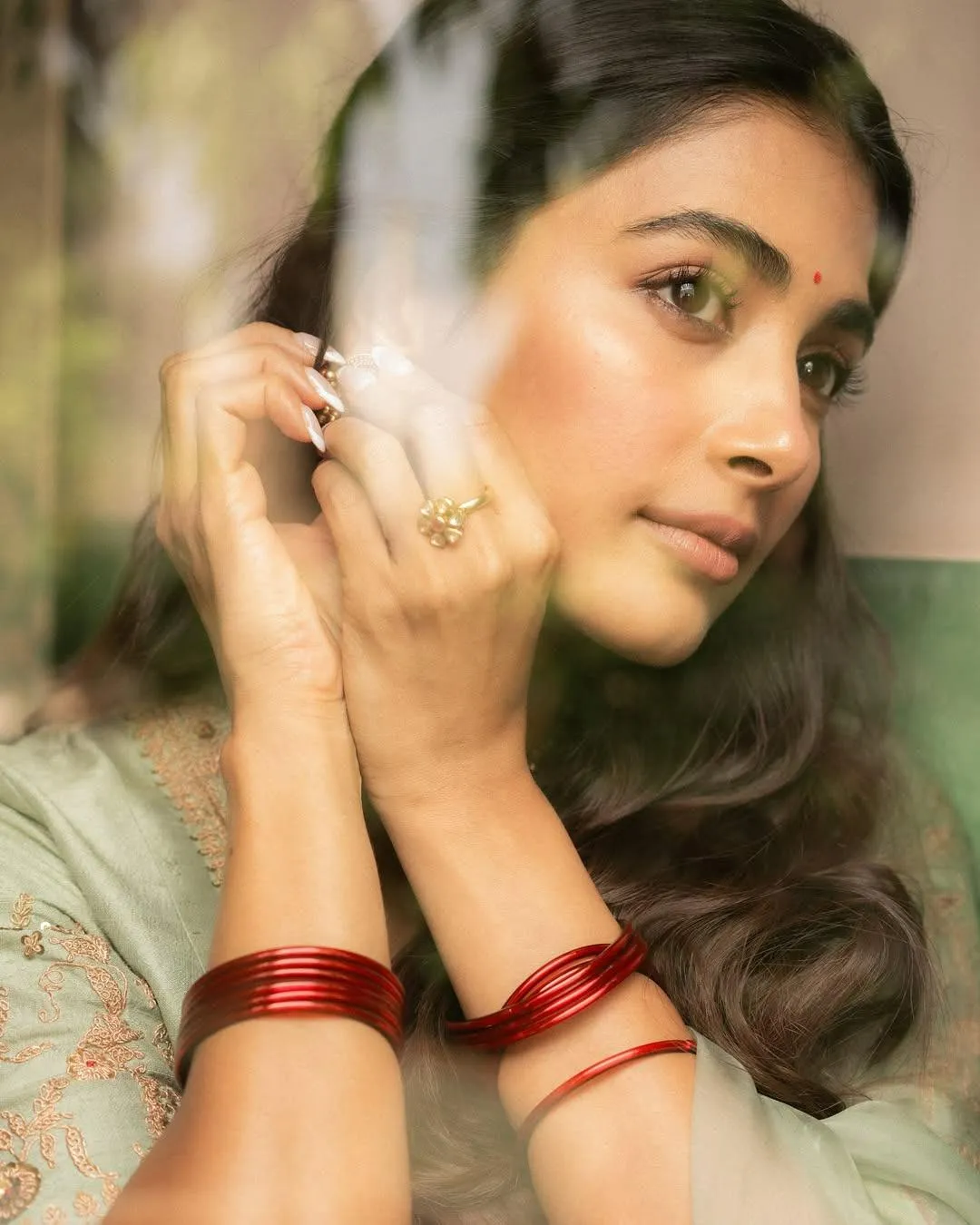 Pooja Hegde Thoughtful Portrait Behind Glass Reflection