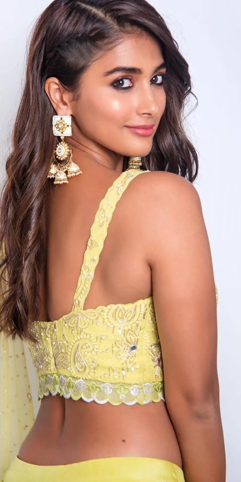 Pooja Hegde Turns Back in Yellow Traditional Wear Image