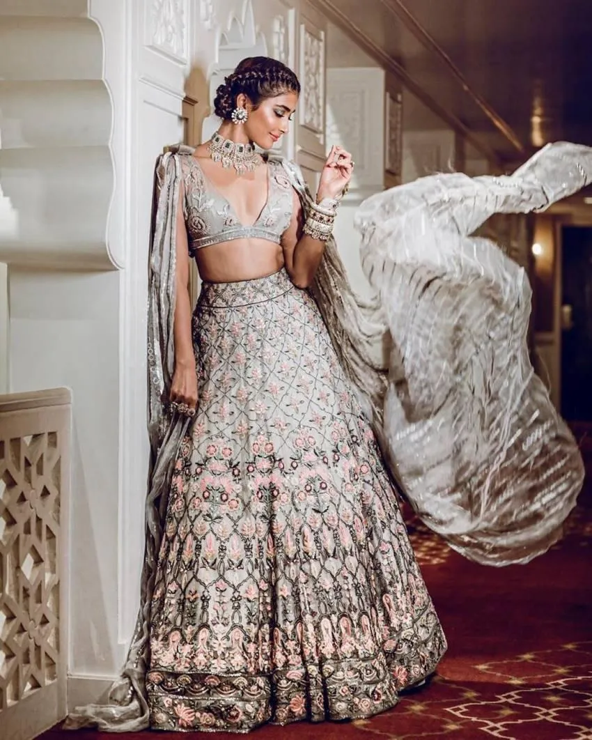 Pooja Hegde Twirls in Embroidered Lehenga Indoors Wallpaper