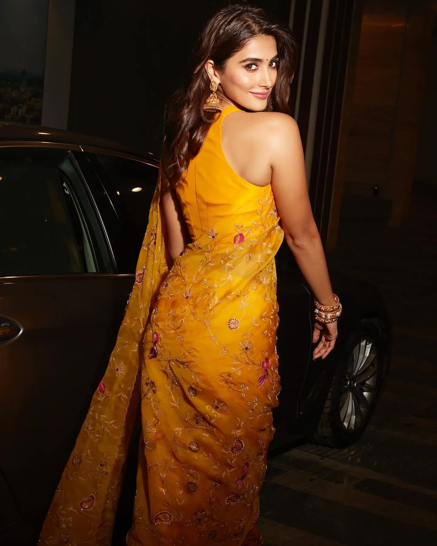 Pooja Hegde Walking Away Wearing Elegant Yellow Saree
