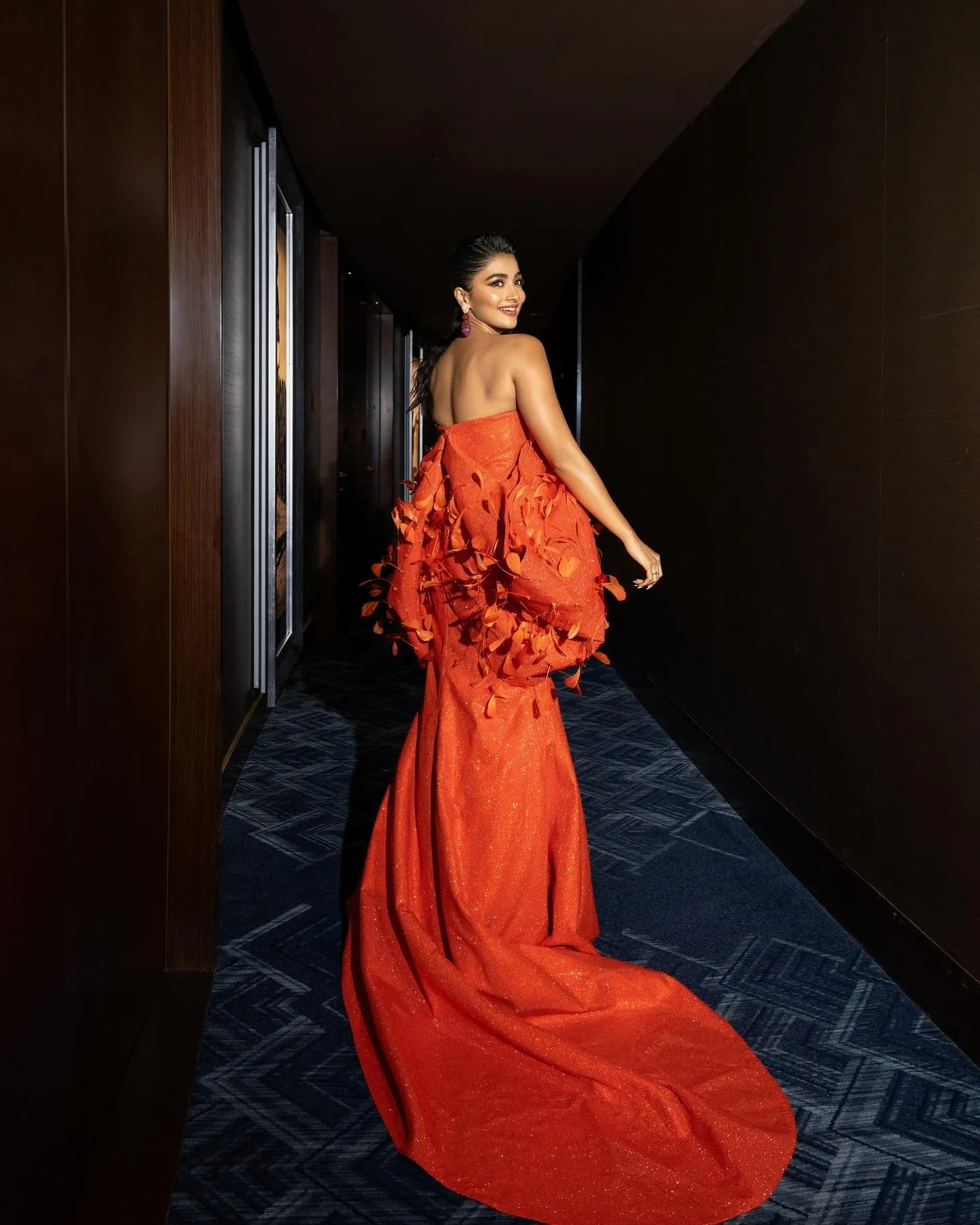 Pooja Hegde Walking in Dramatic Orange Dress in Dark Corridor