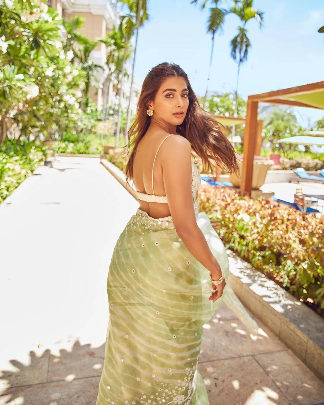 Pooja Hegde Walking Outdoors in Green Saree Dress Wallpaper