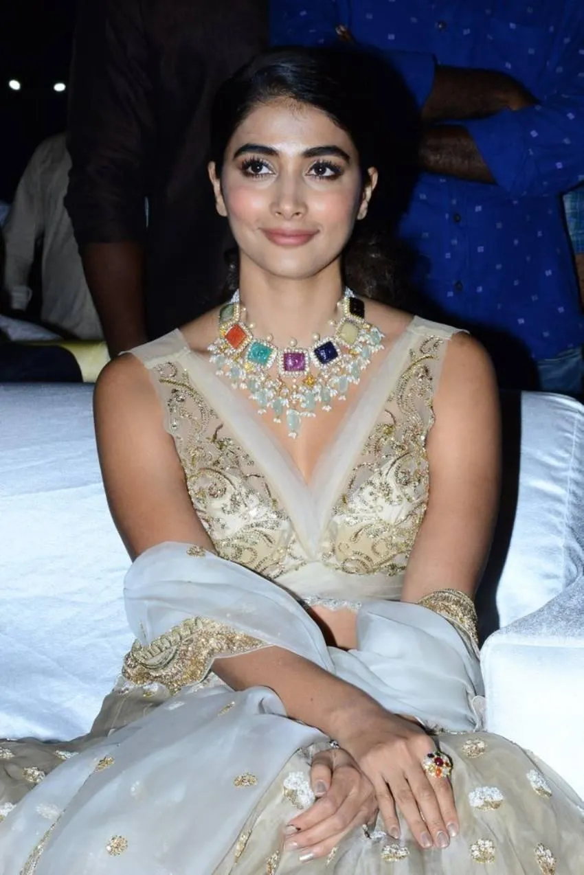 Pooja Hegde Wearing Heavy Jewelry in a Golden Gown Image