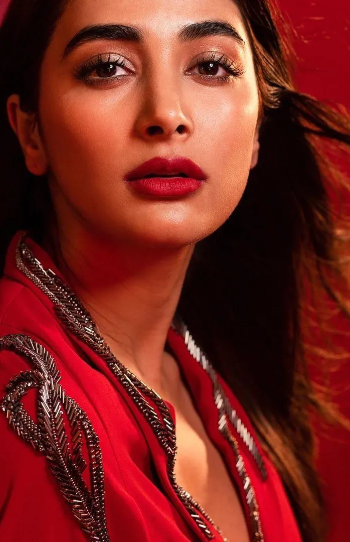 Pooja Hegde Wearing Red Outfit with Bold Makeup Looking Away