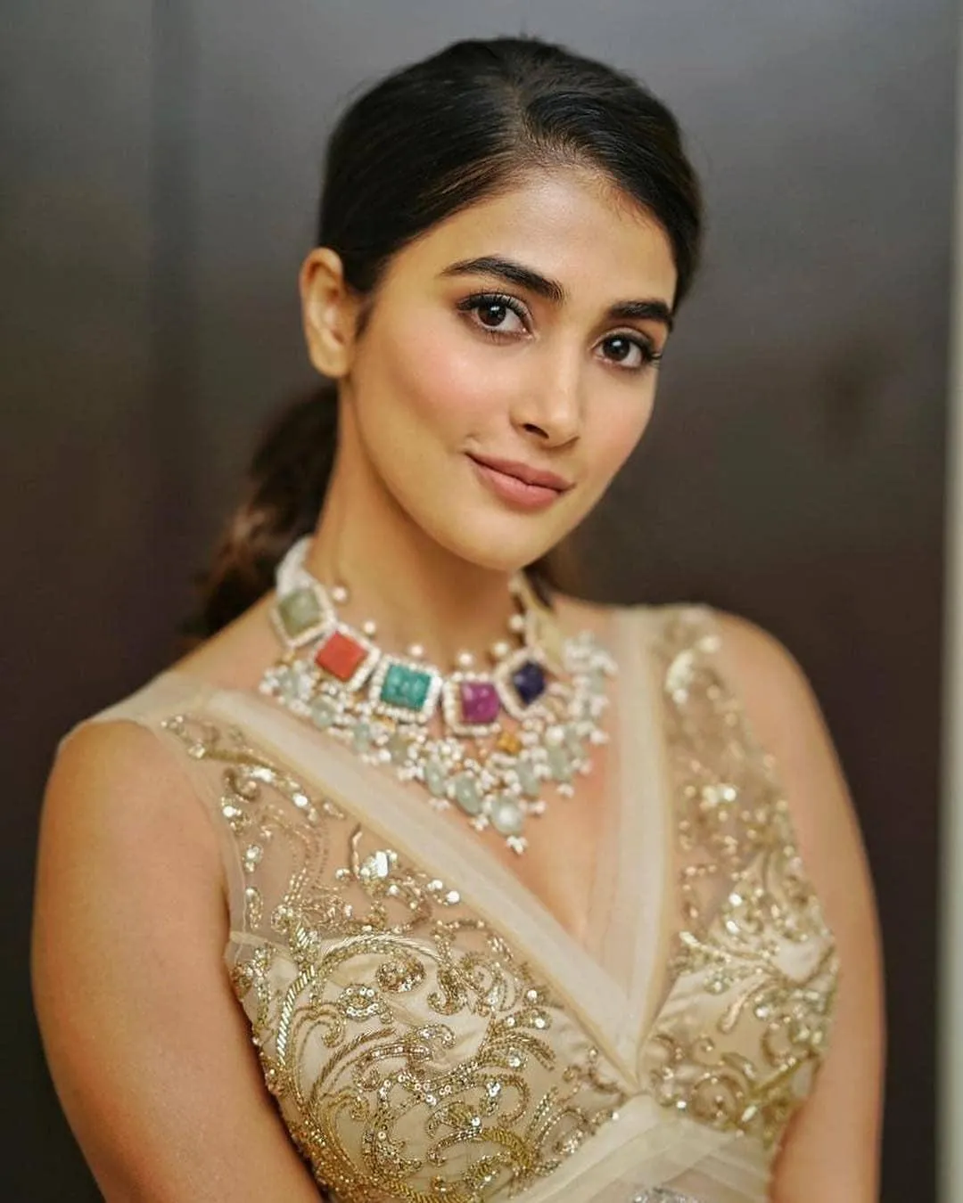 Pooja Hegde Wears a Golden Dress and Colorful Necklace