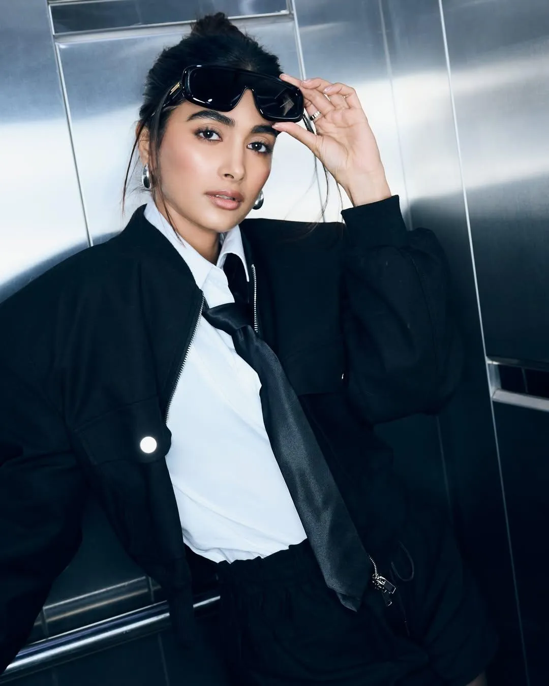 Pooja Hegde Wears Stylish Black Suit with Tie and Hat