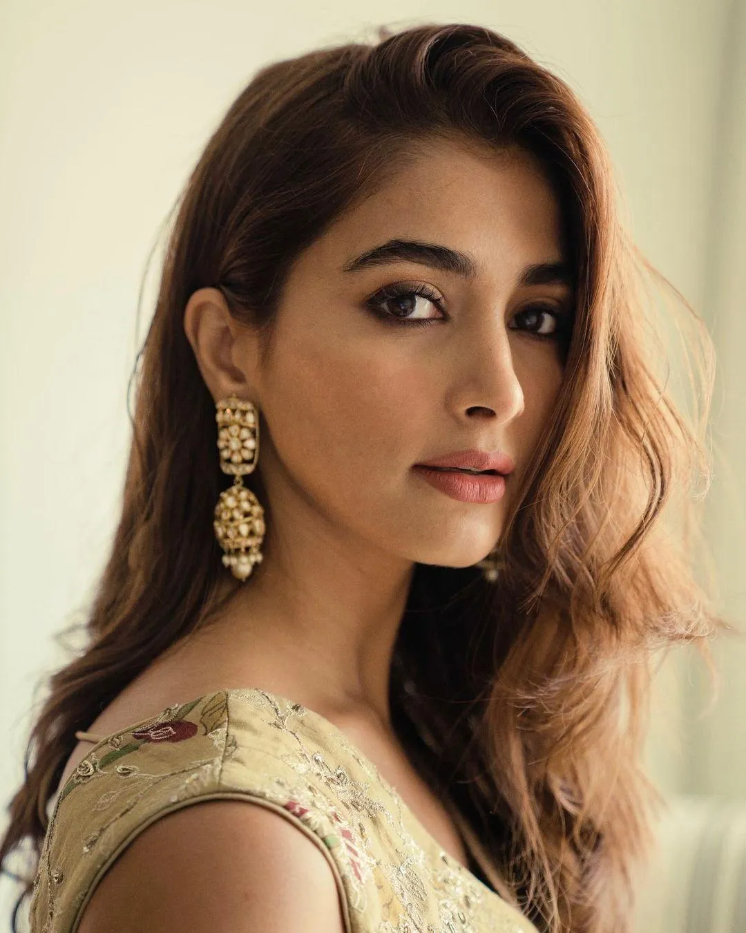 Pooja Hegde with Long Hair and Heavy Earrings Posing Indoors