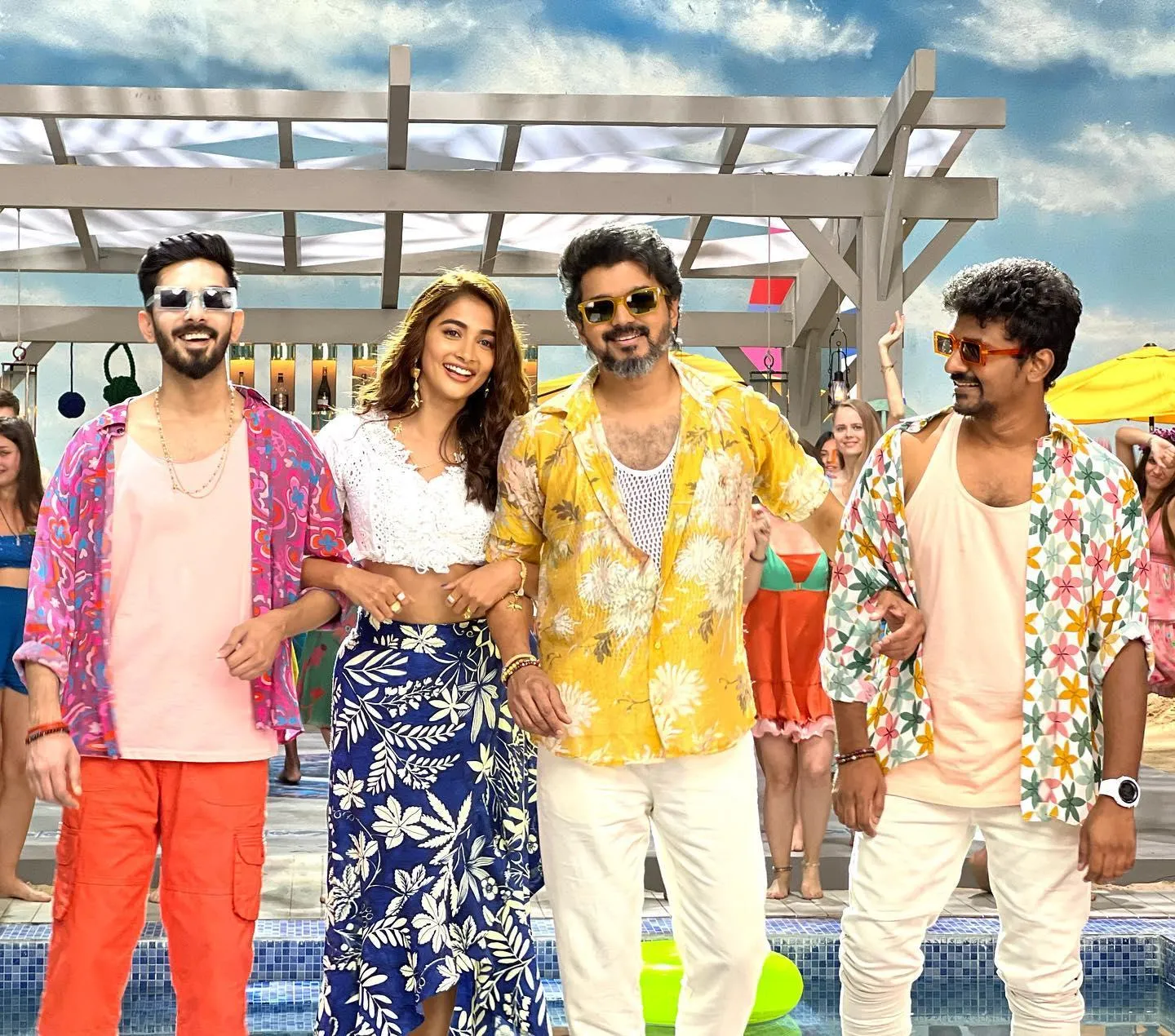Pooja Hegde with Movie Cast in Colorful Beach Outfit Image