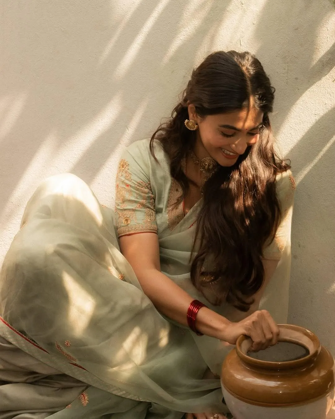 Pooja Hegde Working with Pottery in Traditional Clothes