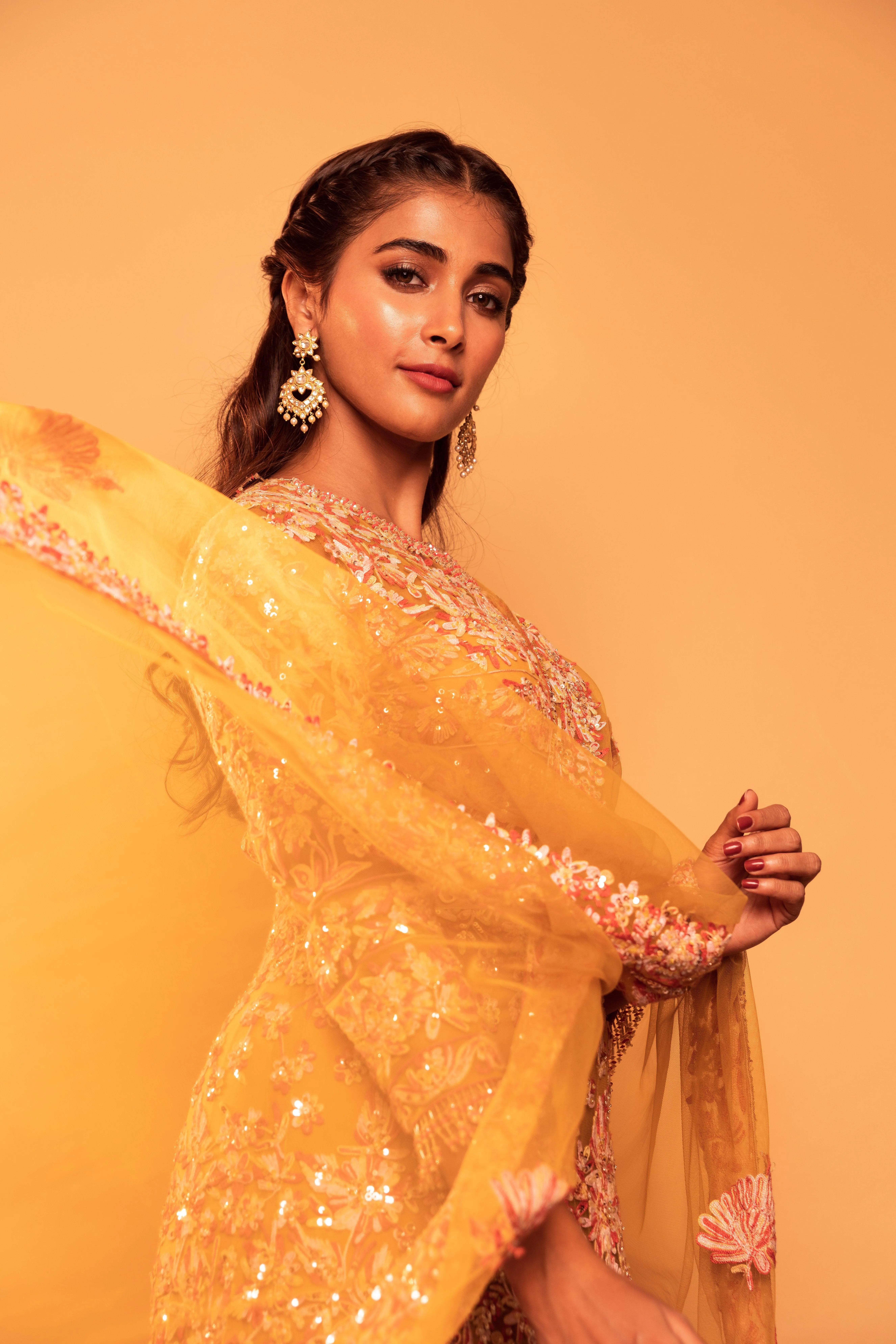 Radiant Pooja Hegde in Golden Outfit Posing Confidently