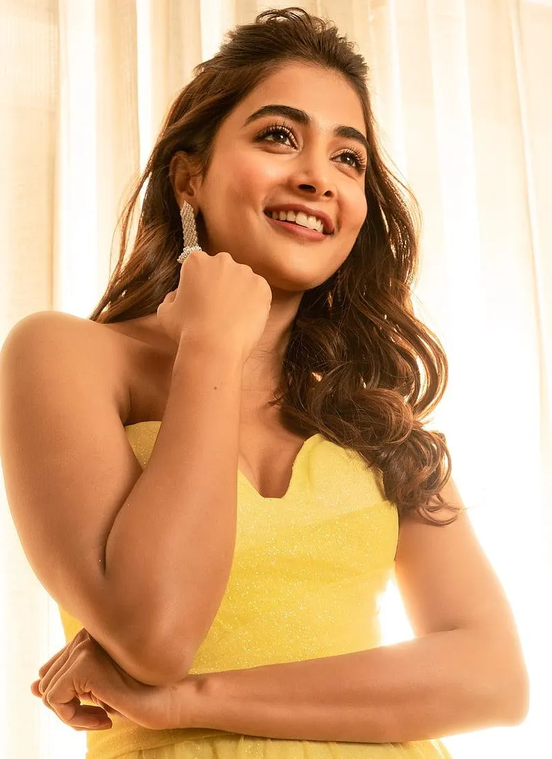 Radiant Smile of Pooja Hegde in a Bright Yellow Dress