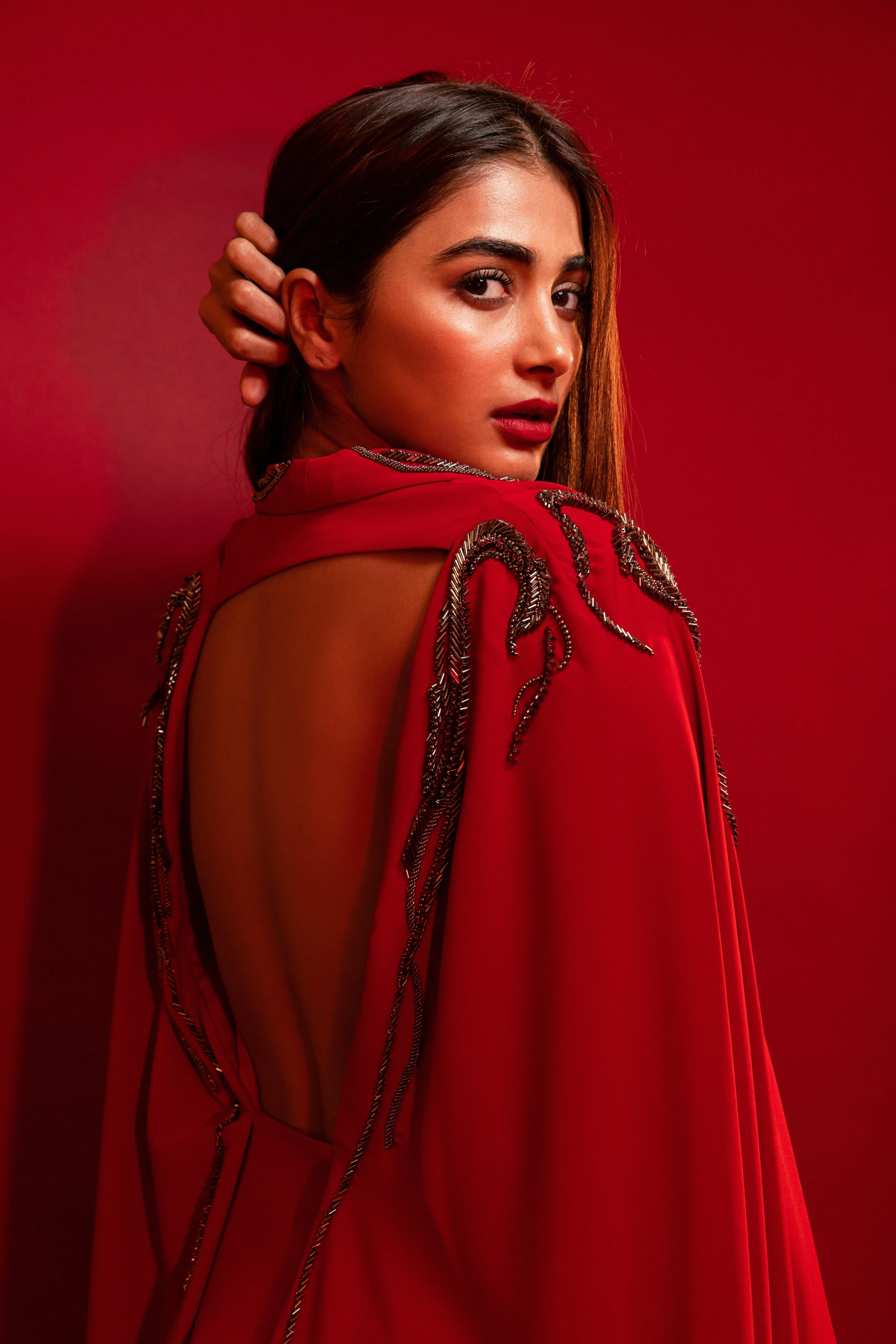 Rear Pose of Pooja Hegde in Deep Red Dress with Open Back