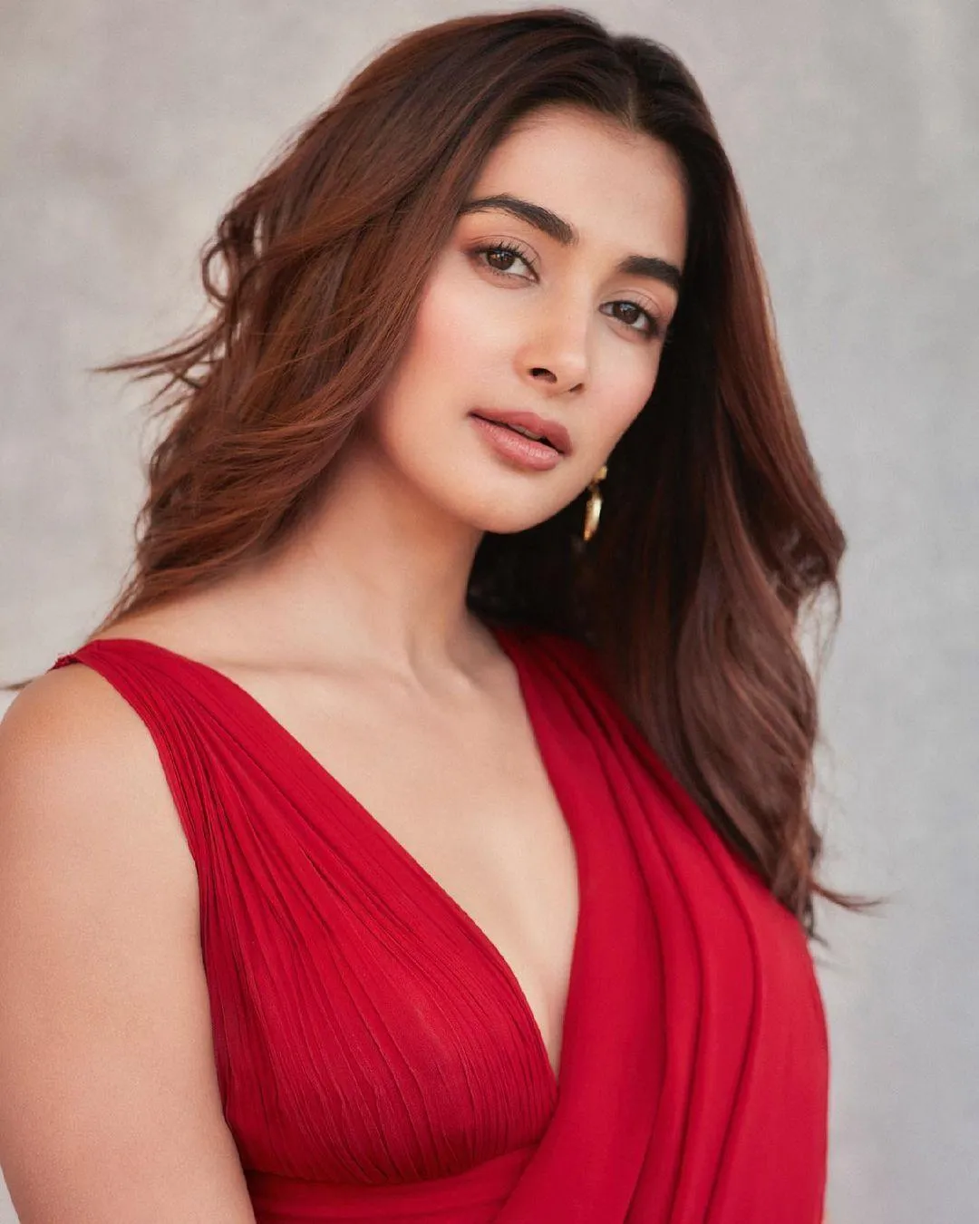 Stunning Pooja Hegde Wearing Red Deep Neck Dress Pose