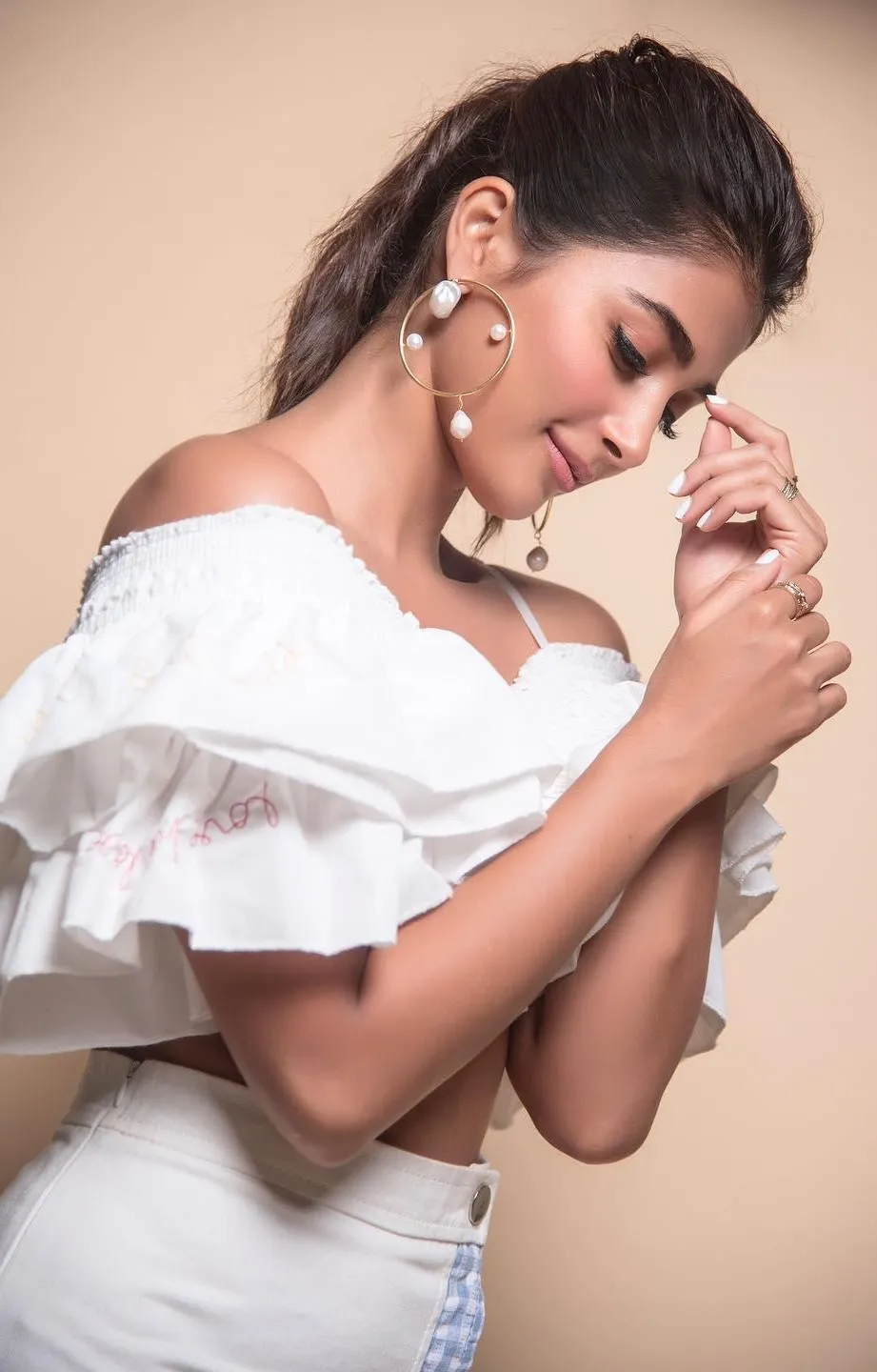 Thoughtful Pooja Hegde in White Off Shoulder Dress Image