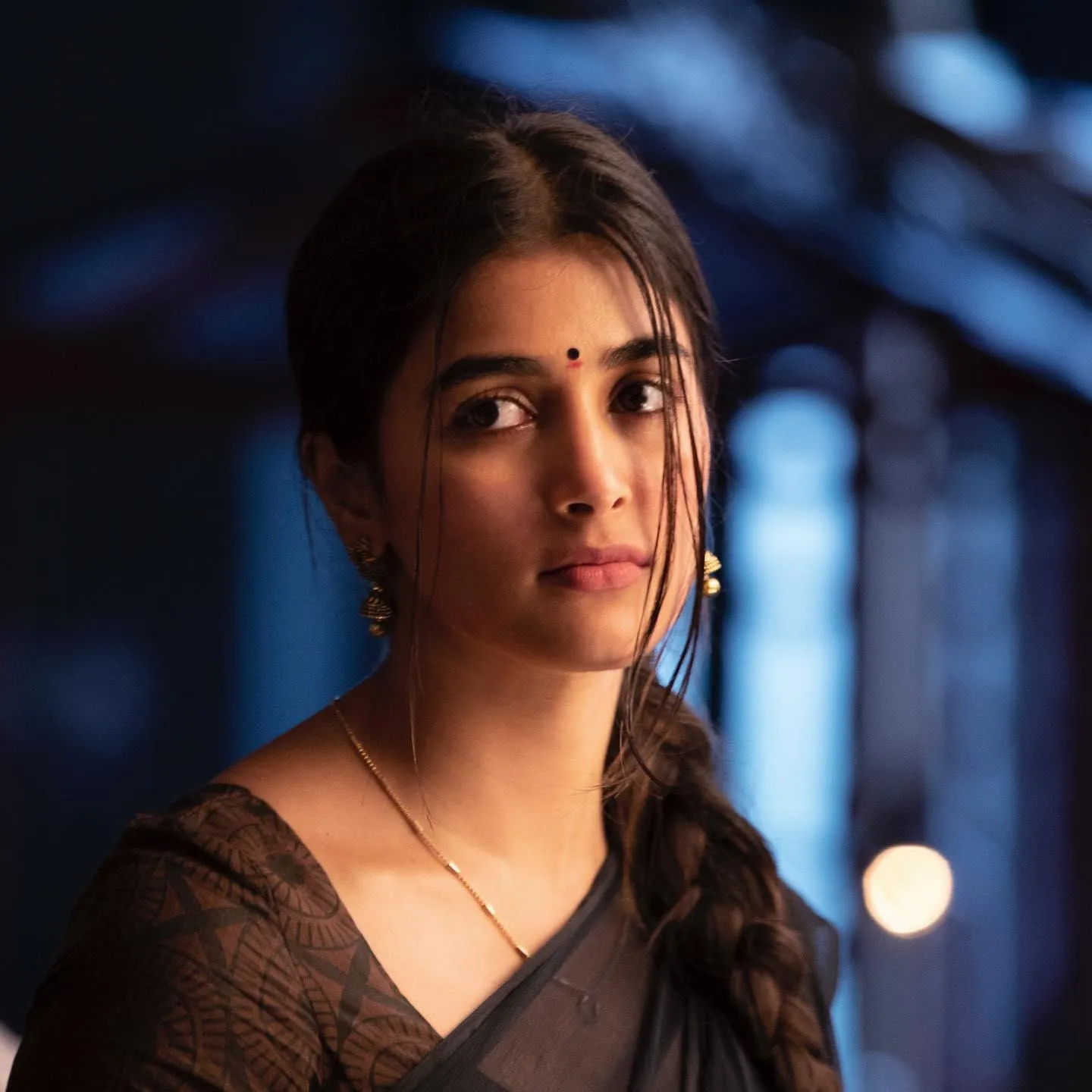 Traditional Look of Pooja Hegde Wearing Brown Saree Indoors