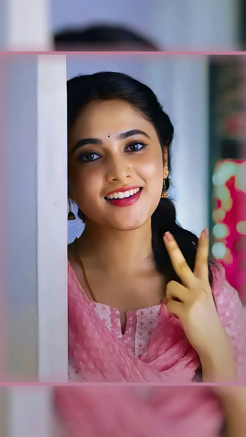 Actress Priyanka in Bright Smile in Pink Ethnic Dress