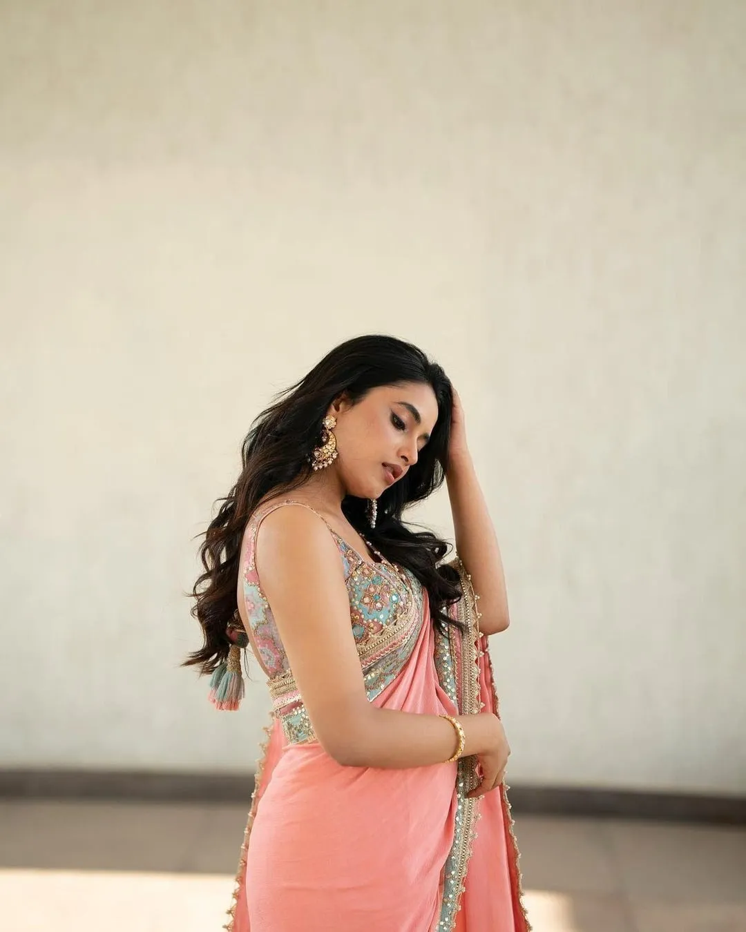 Actress Priyanka in peach ethnic outfit with elegant glance