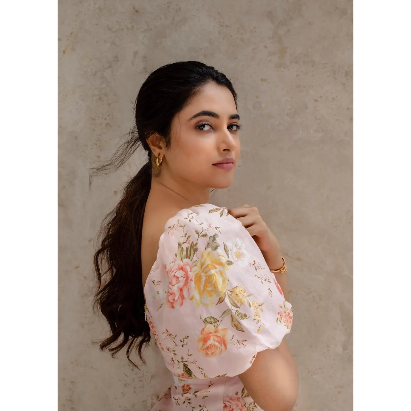 Actress Priyanka in soft pastel outfit with calm expression
