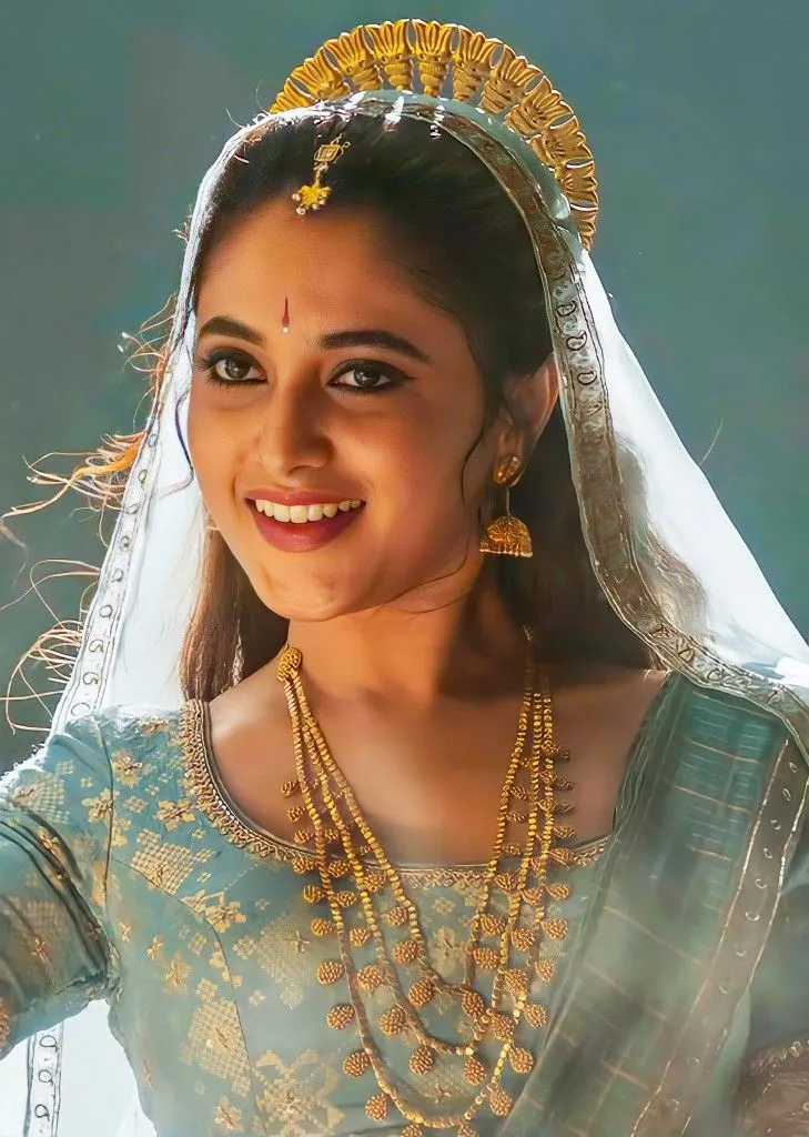 Actress Priyanka in traditional jewelry and blue saree image