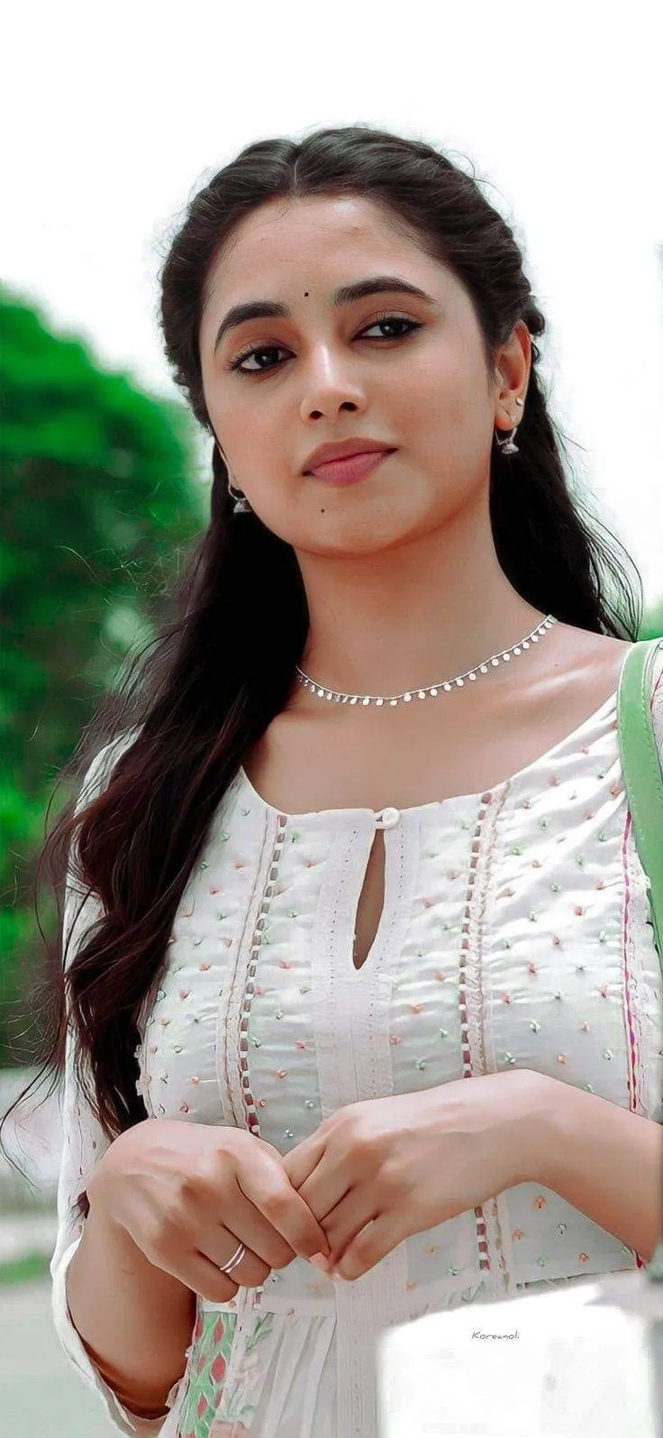 Actress Priyanka in white wear with calm confident look