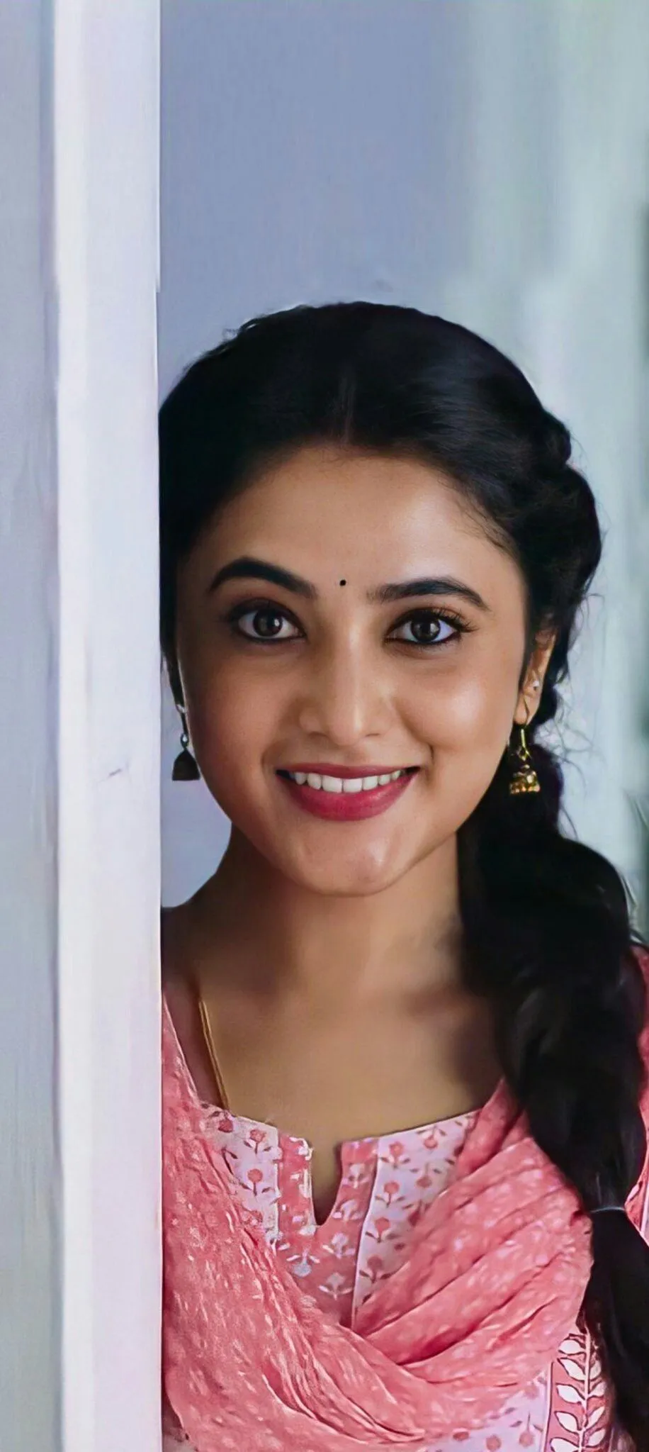 Cheerful Priyanka Arul Mohan Wearing Soft Pink Outfit image