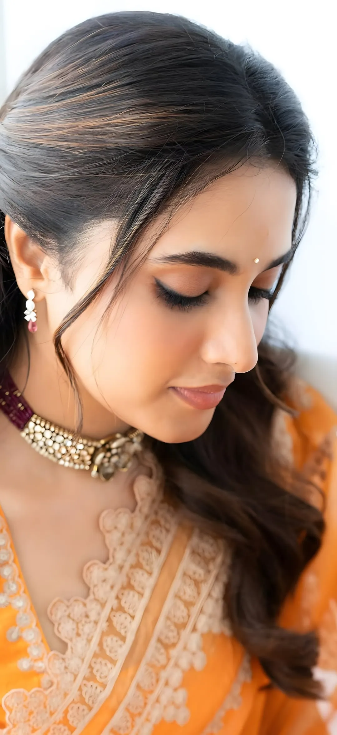 Close Up of Priyanka Mohan in an Orange Saree Free Wallpaper