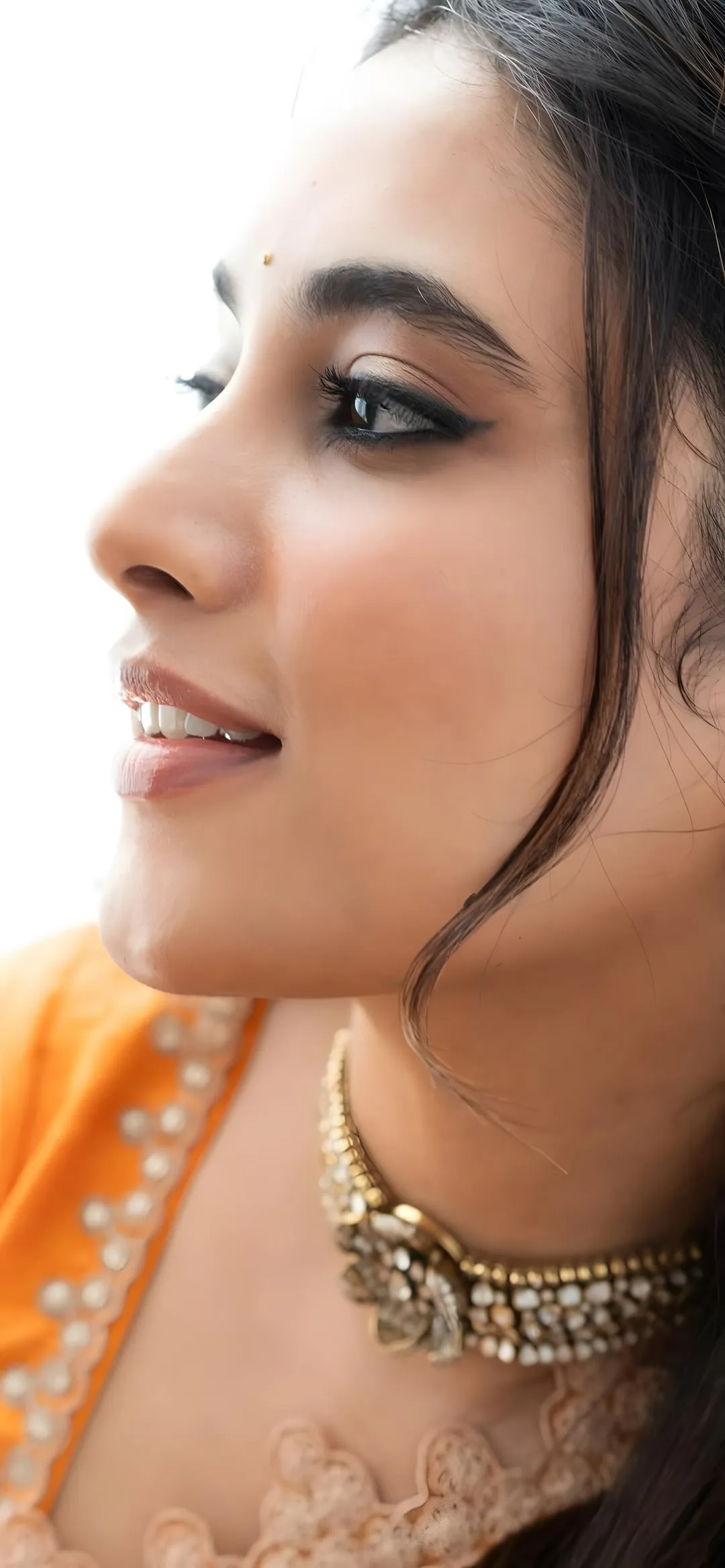 Close Up Portrait Image of Priyanka Mohan in an Orange Saree