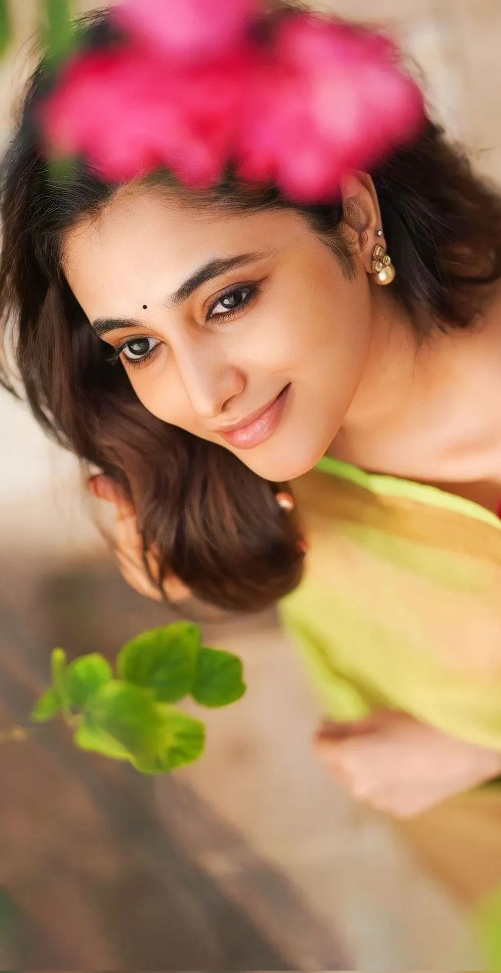Closeup of Priyanka Arul Mohan Smiling near Green Leaves