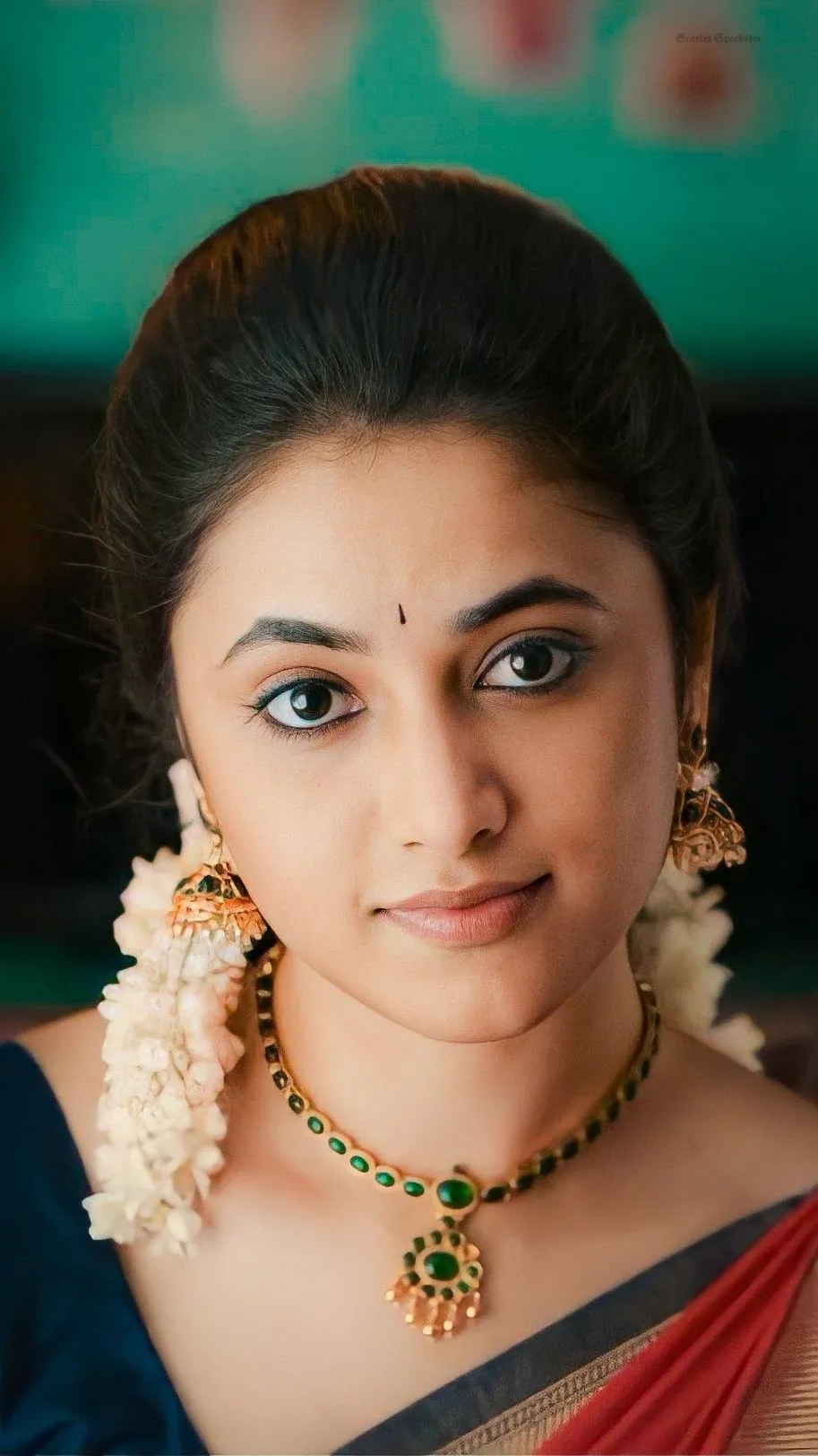 Closeup of Priyanka Arul Mohan with traditional jasmine