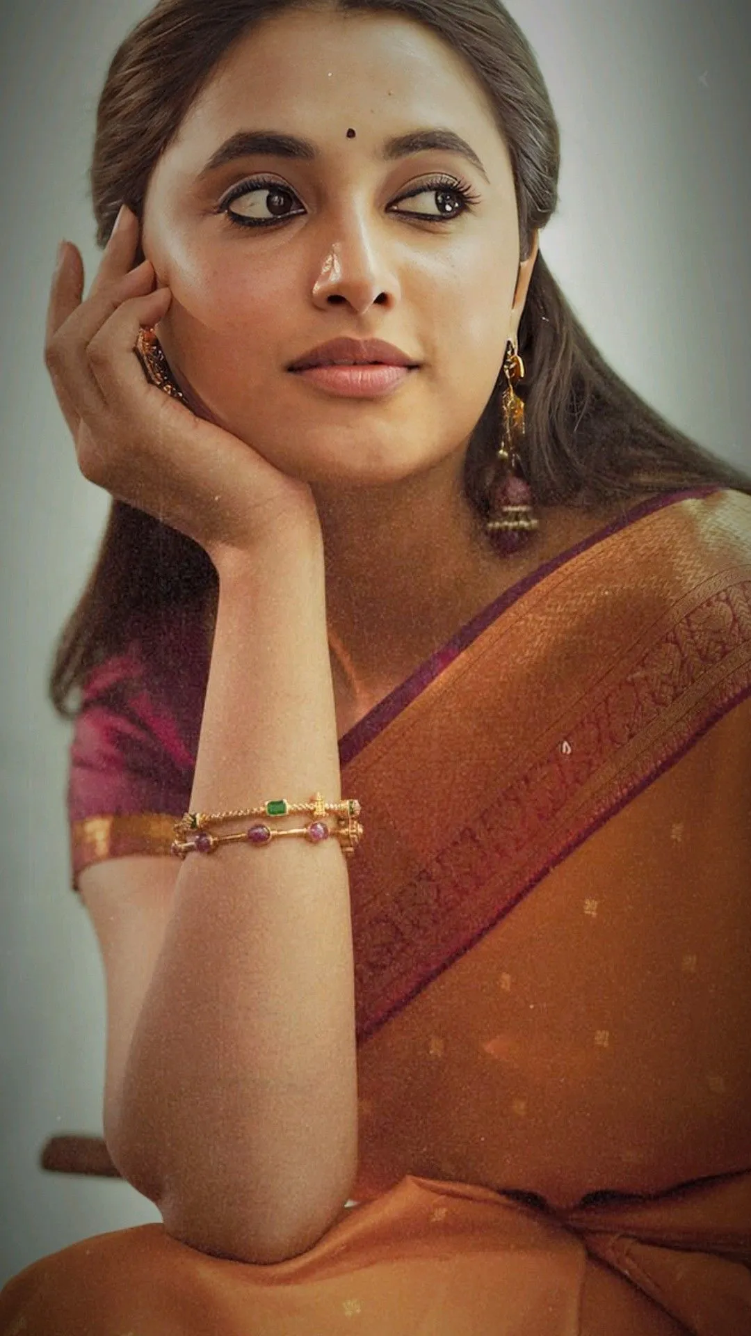 Detailed View of Priyanka Mohan Wearing an Orange Saree