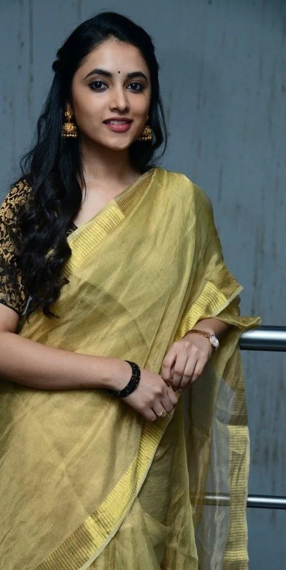 Elegant Priyanka Arul Mohan in Golden saree posing image
