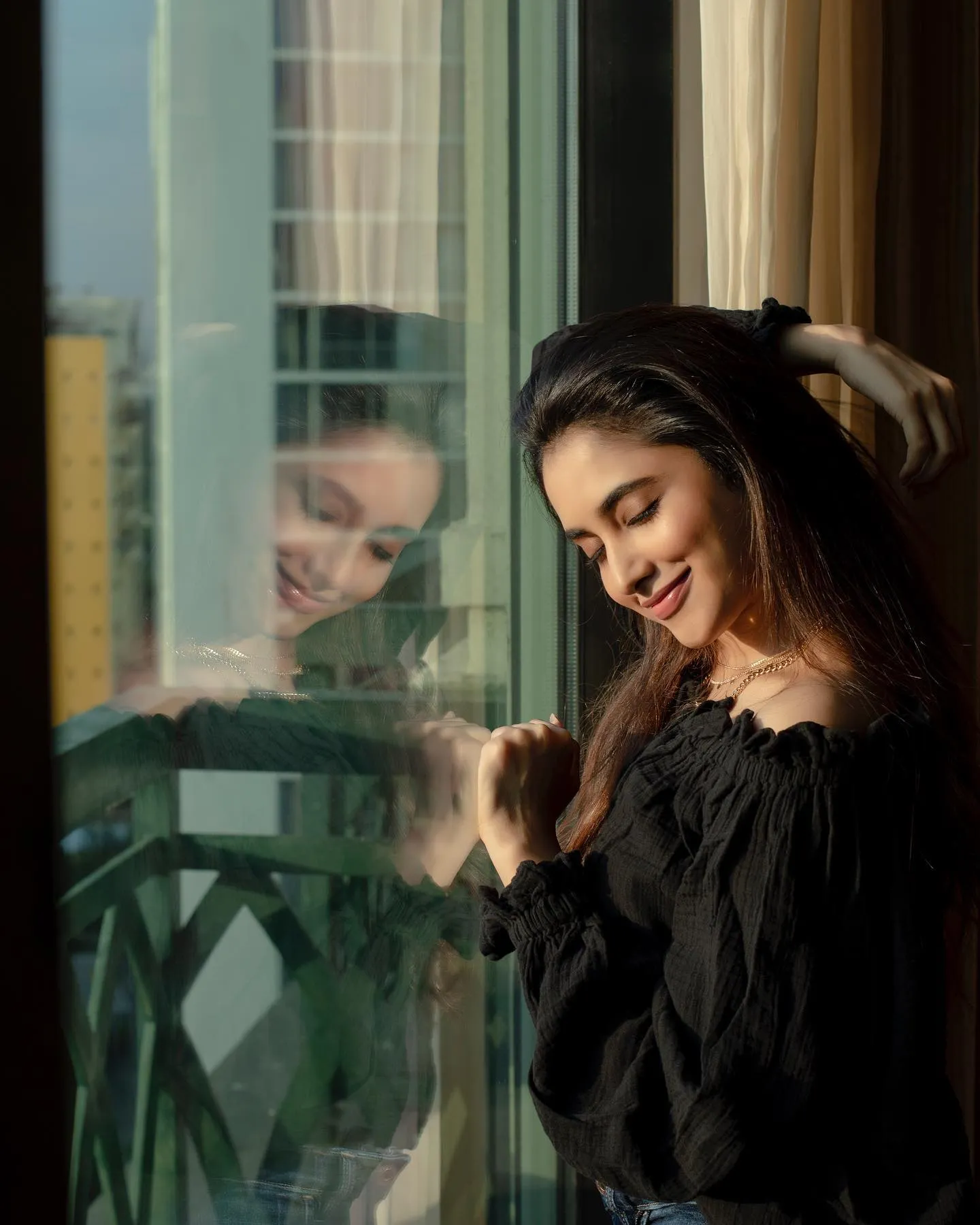 Elegant Priyanka Arul Mohan Looking Through Balcony Glass