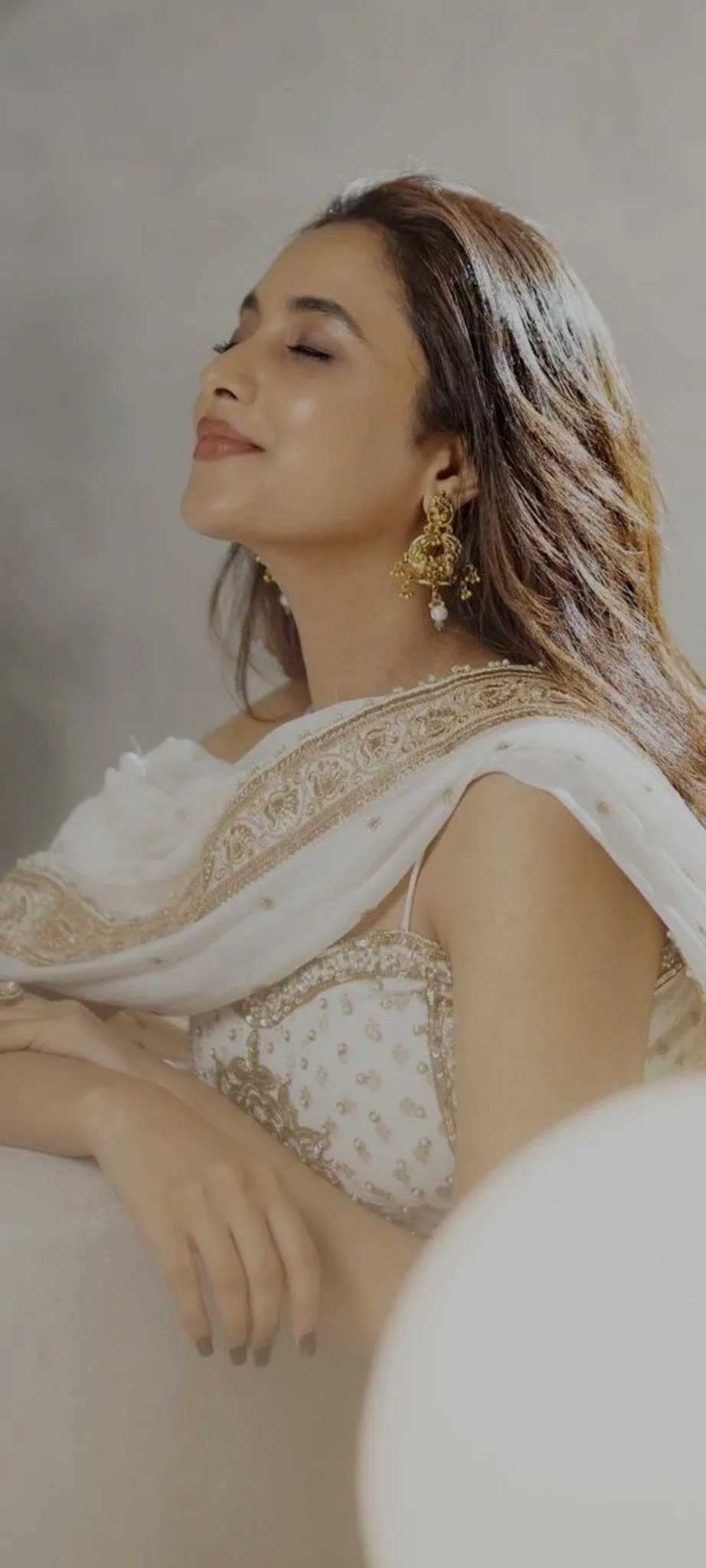 Elegant Priyanka posing softly in white Outfit Wallpaper