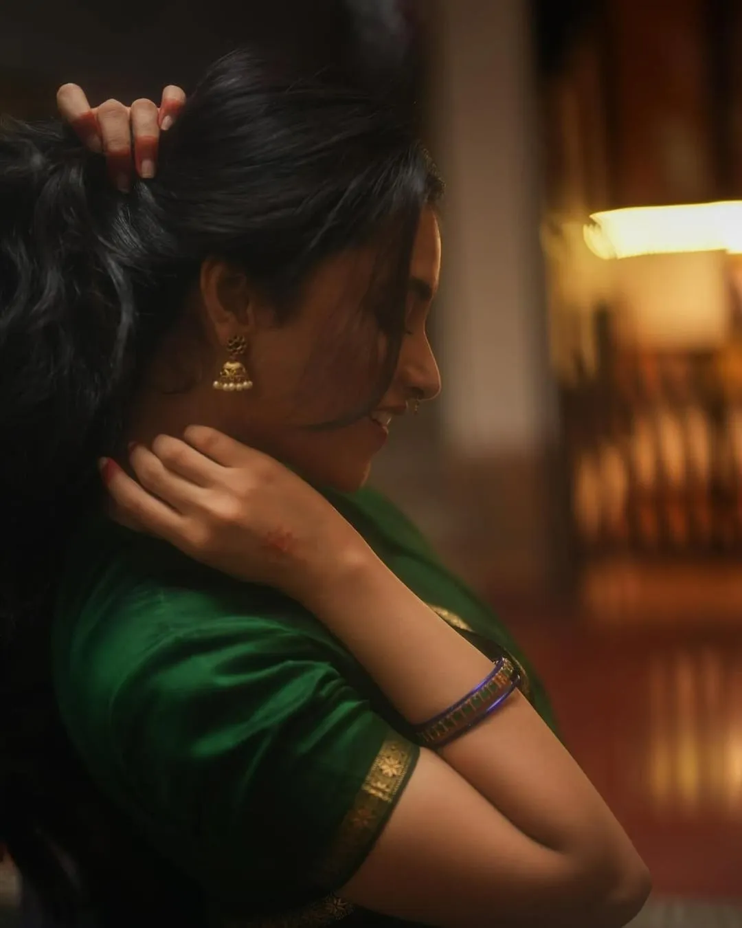 Elegant Side Pose of Priyanka Arul Mohan in Green Saree