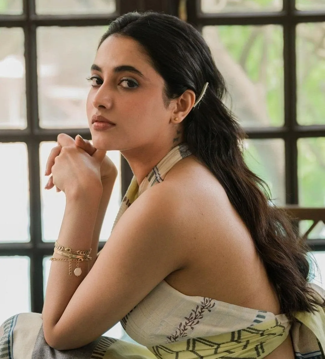 Glamorous Image of Priyanka Mohan Sitting in a Modern Dress
