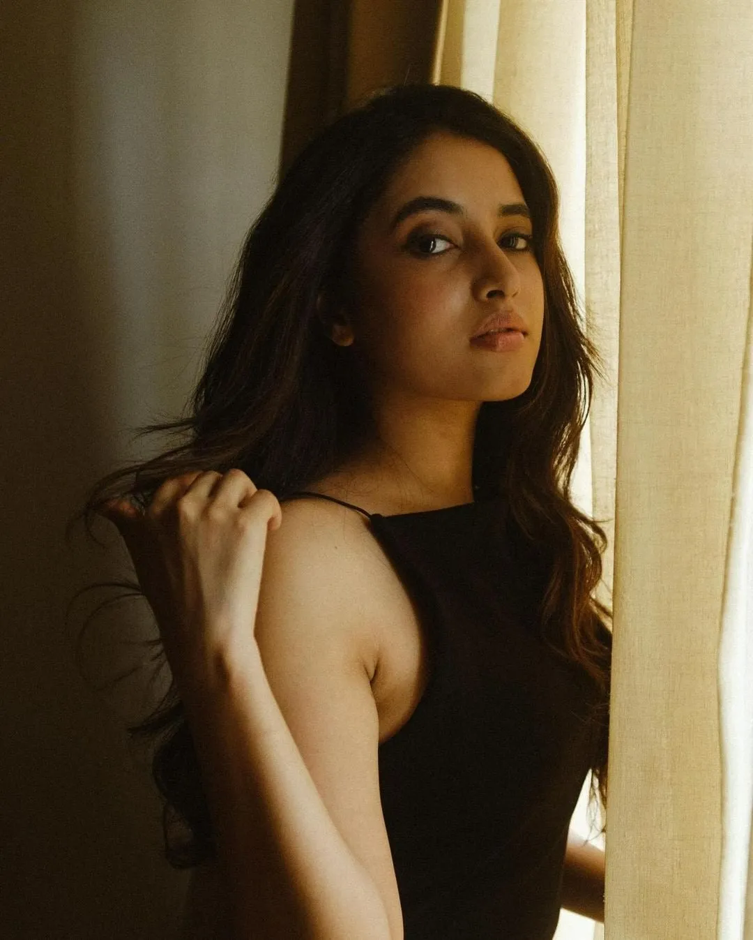 Hot Post of Priyanka Mohan in a Black Dress Near the Window