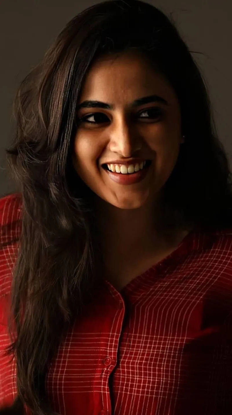 Joyful CloseUp of Priyanka Arul Mohan in Red Dress image
